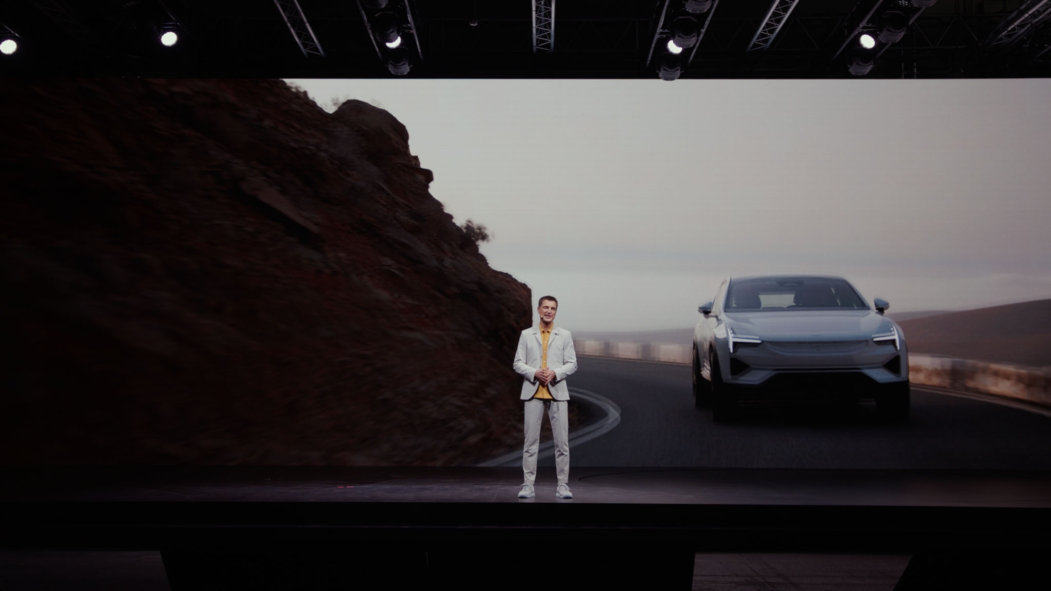 Polestar CEO stands in front of audience. Presents the new electric car, Polestar 3.